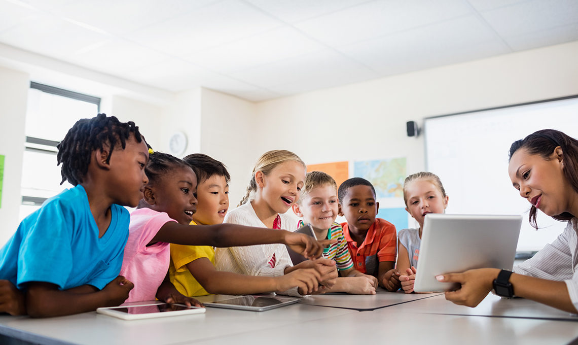 Students use tablets in the classroom